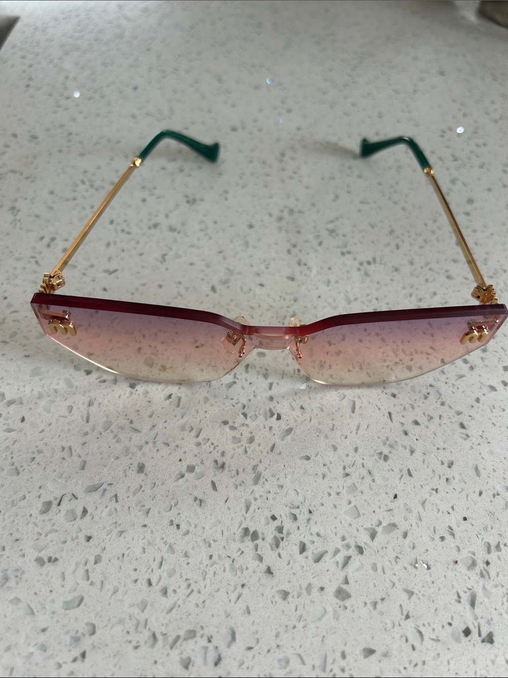 Miu Miu Pink Gradient Rimless Sunglasses with Gold Arms and Green Tips